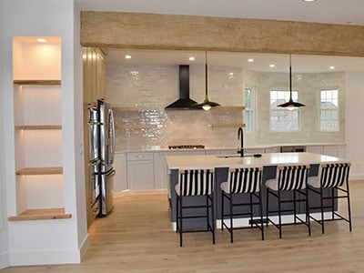 Timberthane beams bordering the living room and the kitchen.